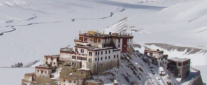 Snow-covered monastery in Spiti Valley with Himalayan backdrop